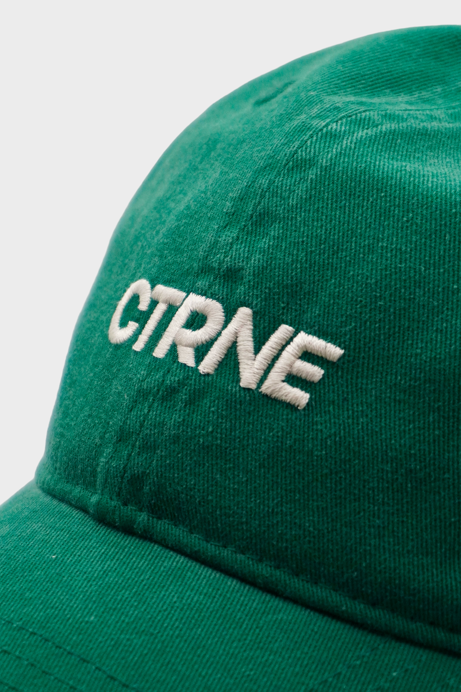 GEODE MANIFEST CAP IN GREEN/WHITE LOGO